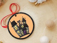 Halloween haunted house with black cat ornament