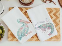 CapableByDesign floral pelican and floral shrimp throw pillows and matching towels