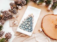 CapableByDesign oyster shell Christmas tree with pink bow pillows and matching towels