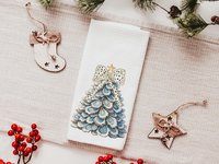CapableByDesign oyster shell Christmas tree with polka dot bow pillows and matching towels