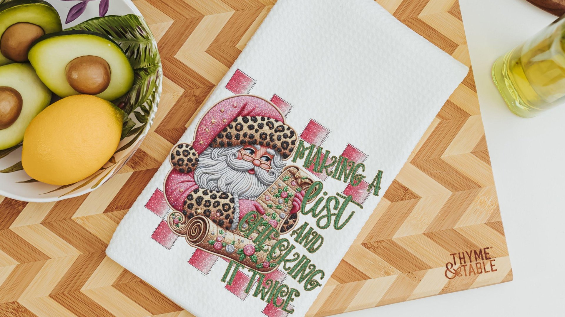 making a list and checking it twice pink Christmas throw pillows for couch, leopard print Santa Claus kitchen towels, sage green Christmas