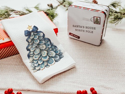 CapableByDesign oyster shell Christmas tree with navy bow pillows and matching towels